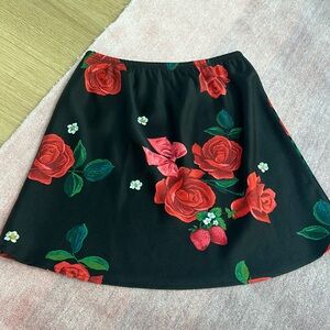 Lisa Says Gah Black Mini Satin Skirt with Red Rose Print